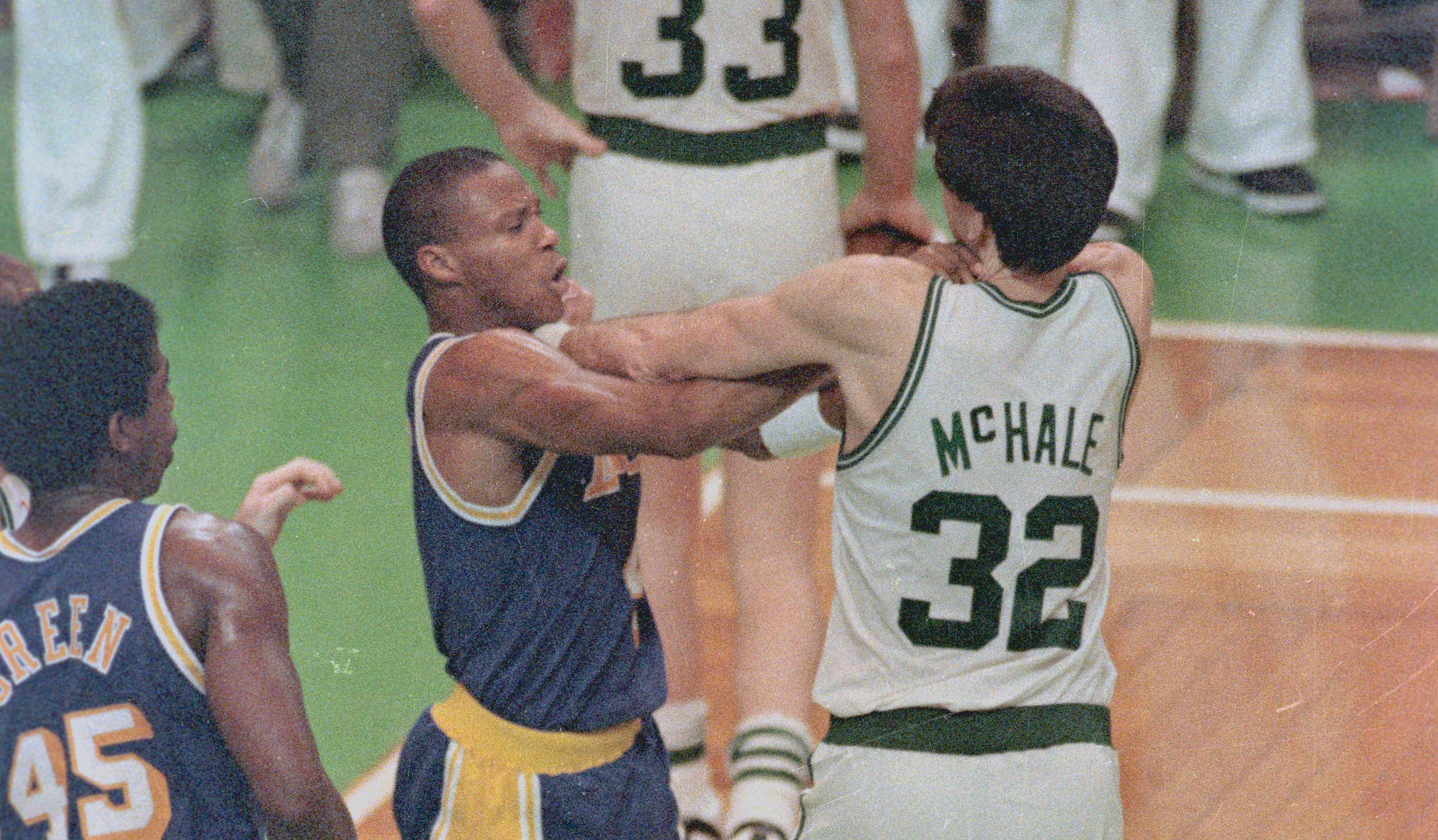 Los Angeles Lakers guard Byron Scott and Boston Celtics forward Kevin McHale fight.