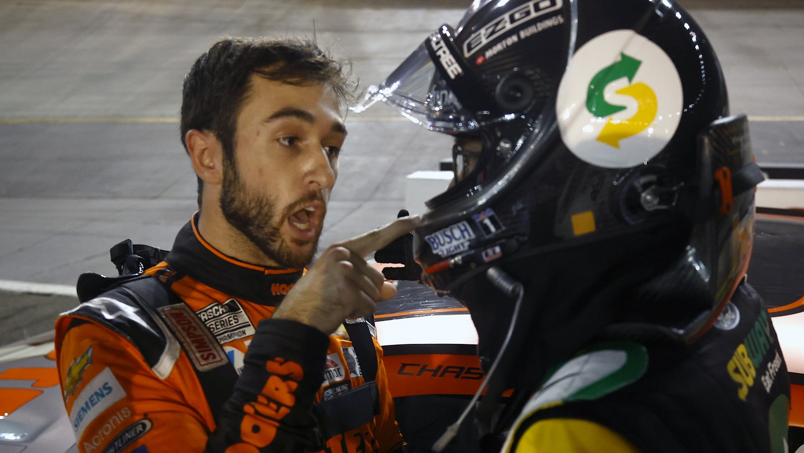 Chase Elliott and Kevin Harvick have a heated conversation after an incident late in the NASCAR Cup Series Bass Pro Shops Night Race at Bristol Motor Speedway on Sept. 18, 2021.