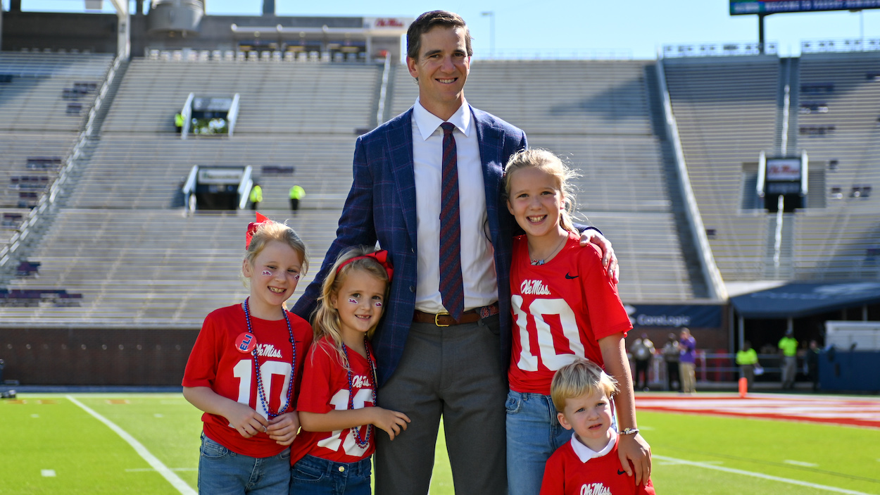 Former Ole' Miss and New York Giants quarterback, Eli Manning, poses with his family.