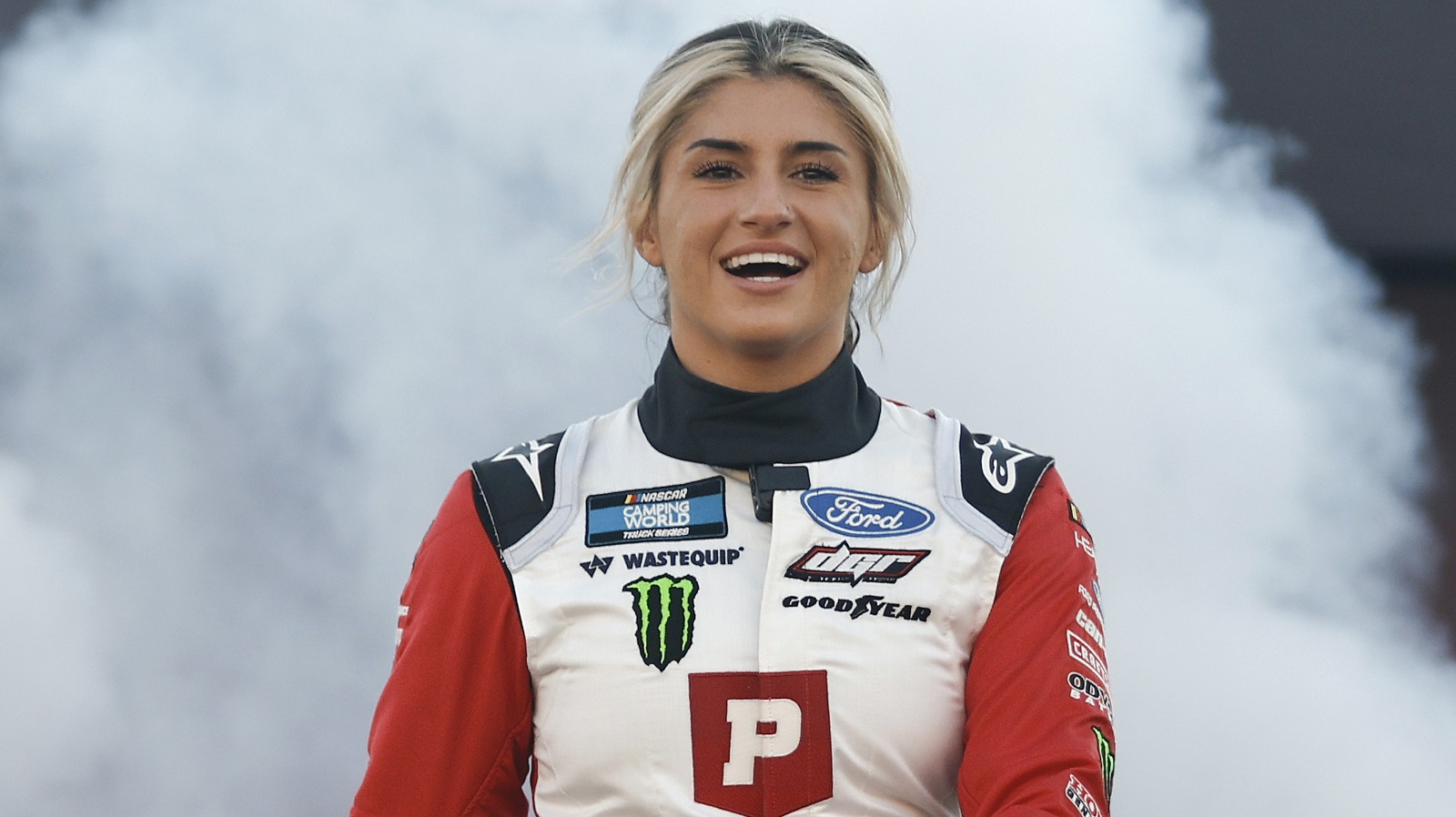 Hailie Deegan walks onstage during driver intros prior to the NASCAR Camping World Truck Series Worldwide Express 250 for Carrier Appreciation at Richmond Raceway on Aug. 13, 2022.