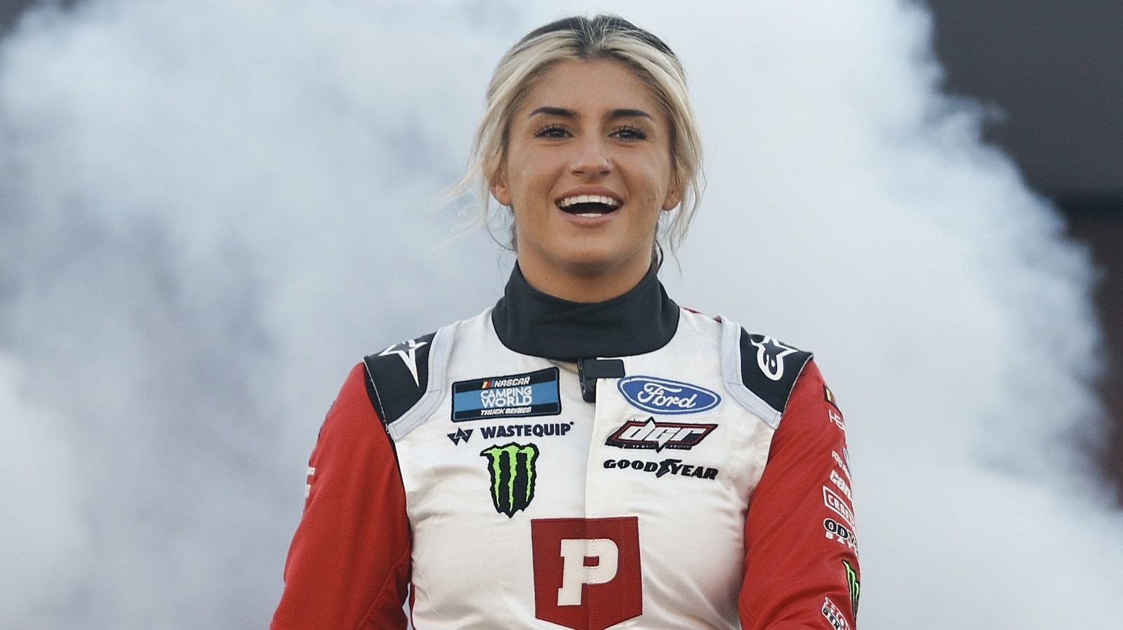 Hailie Deegan walks onstage during driver intros prior to the NASCAR Camping World Truck Series Worldwide Express 250 for Carrier Appreciation at Richmond Raceway on Aug. 13, 2022.