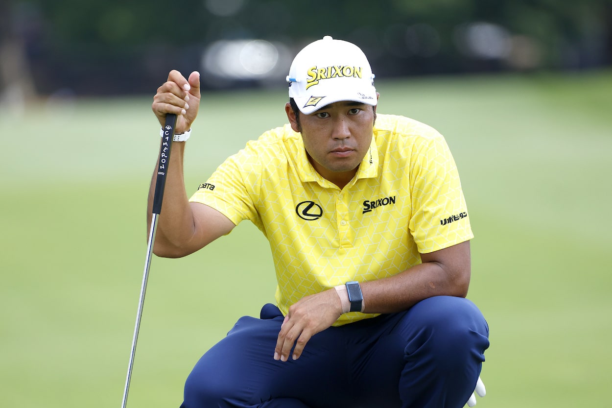 Hideki Matsuyama lines up a putt during the Tour Championship.