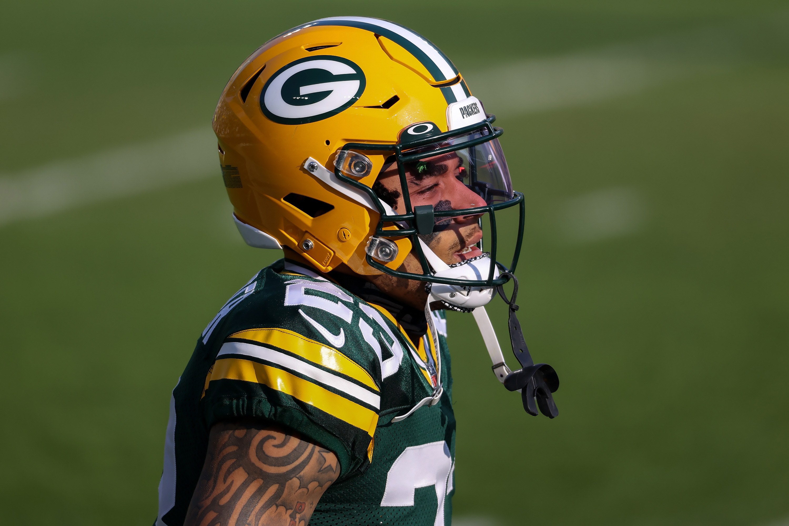 Jaire Alexander of the Green Bay Packers walks across the field before the NFC Championship game against the Tampa Bay Buccaneers.