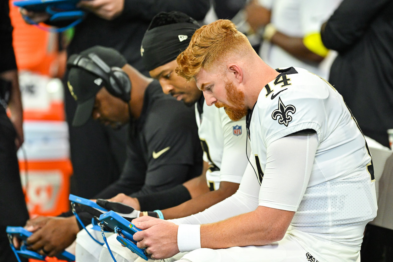 Jameis Winston and Andy Dalton on the New Orleans Saints bnch