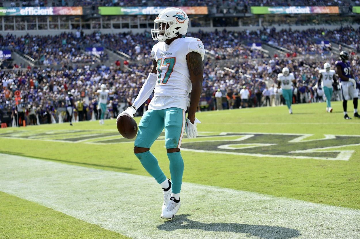 Jaylen Waddle celebrates after scoring a touchdown.