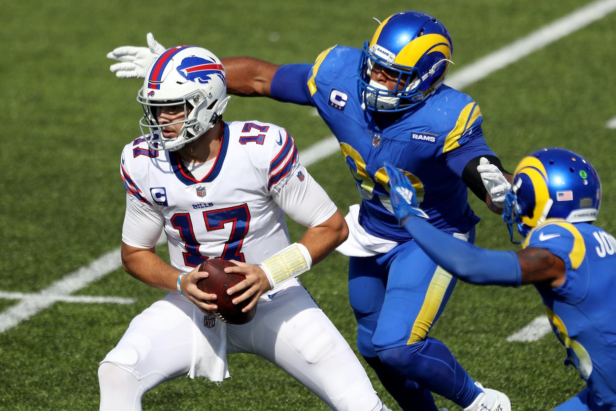 Josh Allen is chased by Aaron Donald.