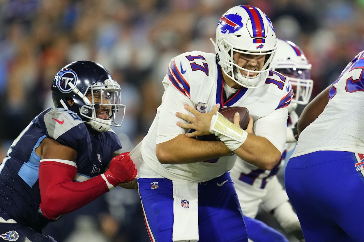 Josh Allen avoids a tackle against the Titans.