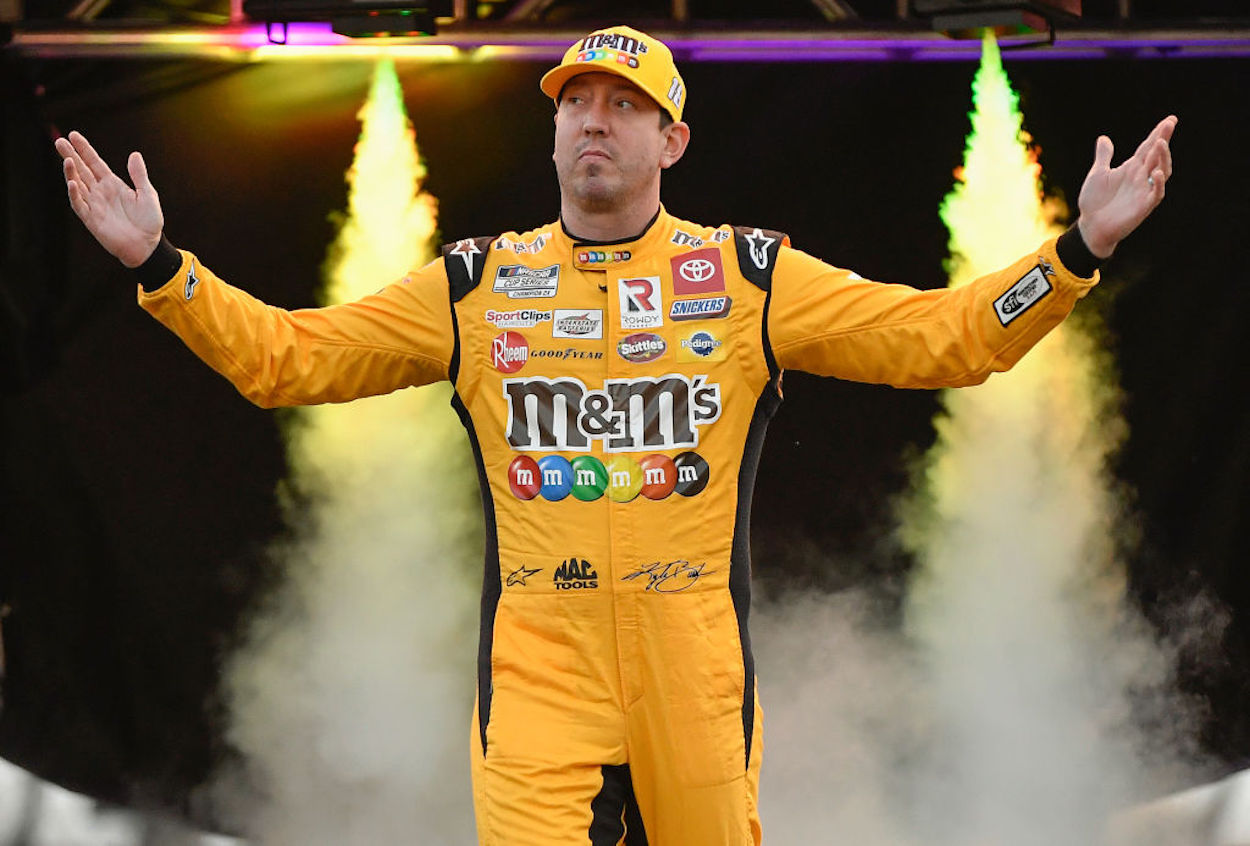 Kyle Busch walks on-stage during drive introductions at the Bass Pro Shops Night Race