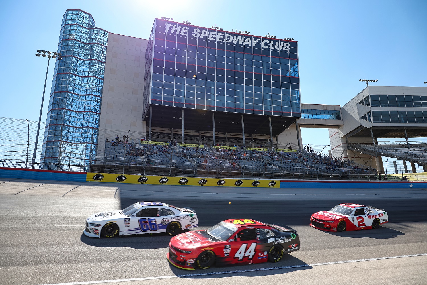 JJ Yeley, left, leads a pack of Xfinity Series cars through a turn at Texas Motor Speedway on Sept. 24, 2022.