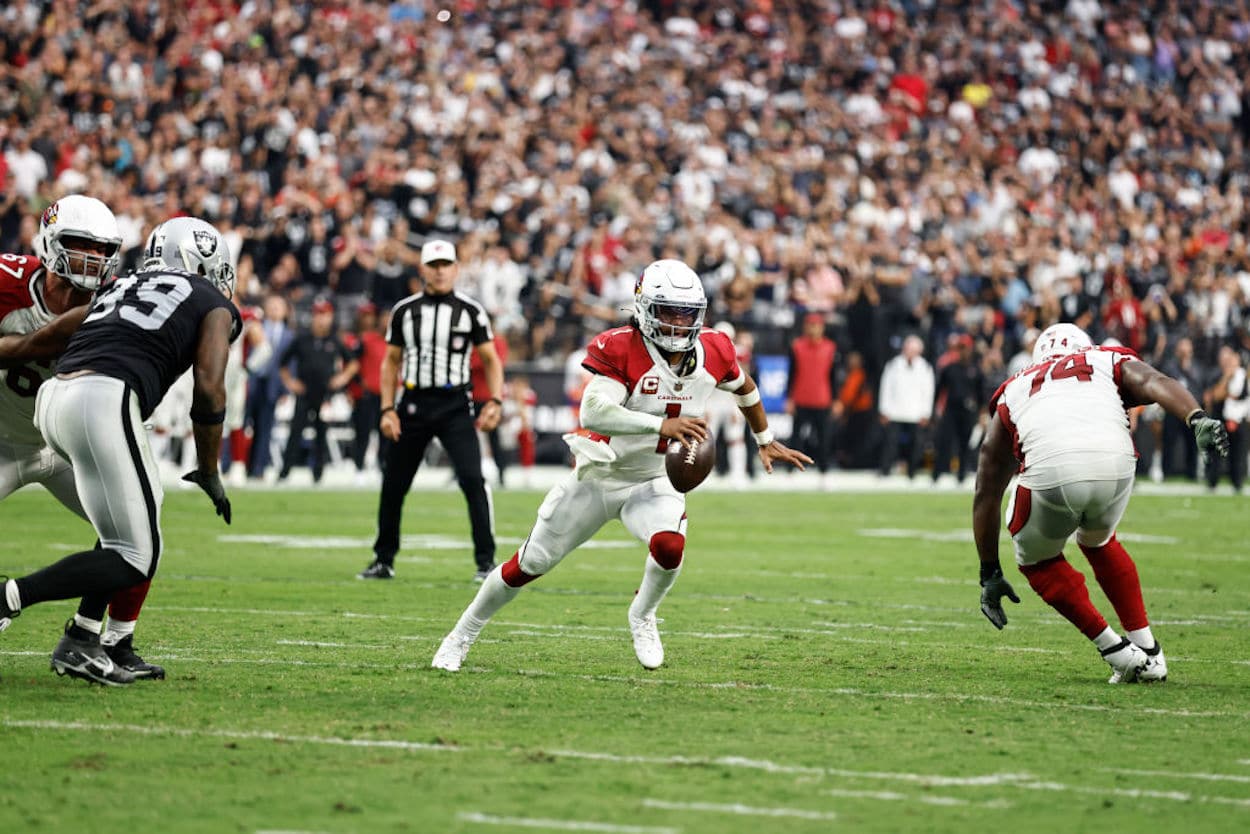Arizona Cardinals quarterback Kyler Murray runs with the ball.