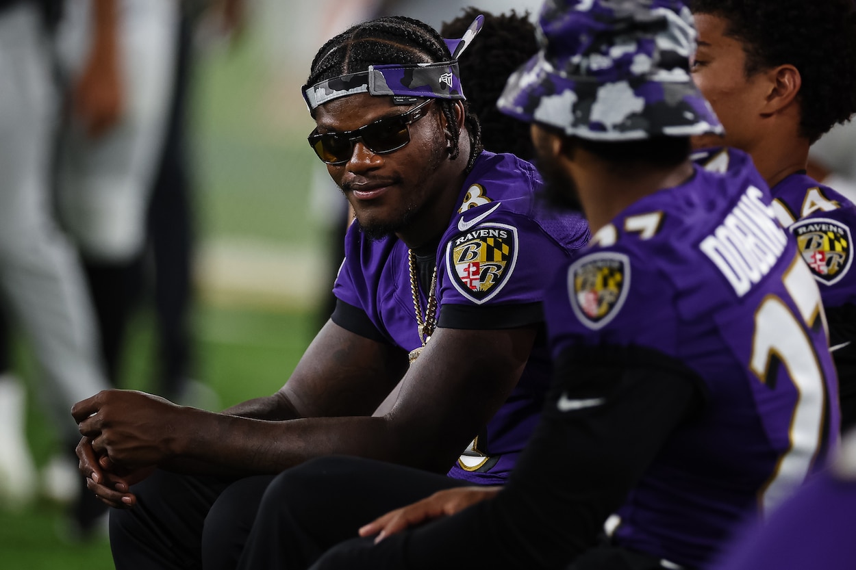 Lamar Jackson looks on during a preseason game.