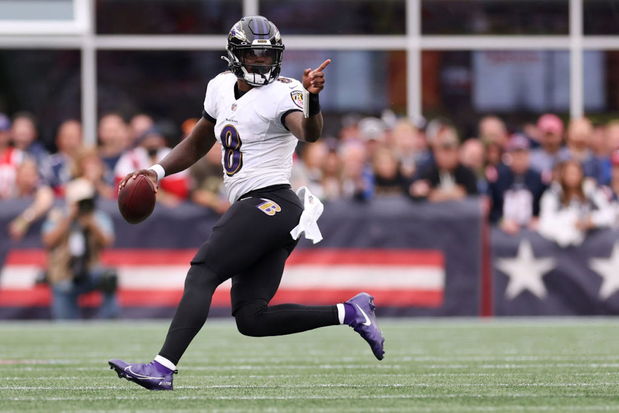Baltimore Ravens quarterback Lamar Jackson scrambles out of the pocket against the New England Patriots.