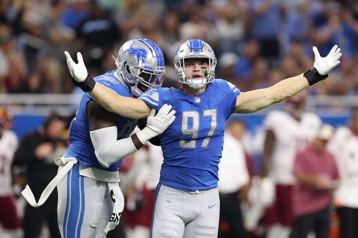 Aidan Hutchinson celebrates his first NFL sack.