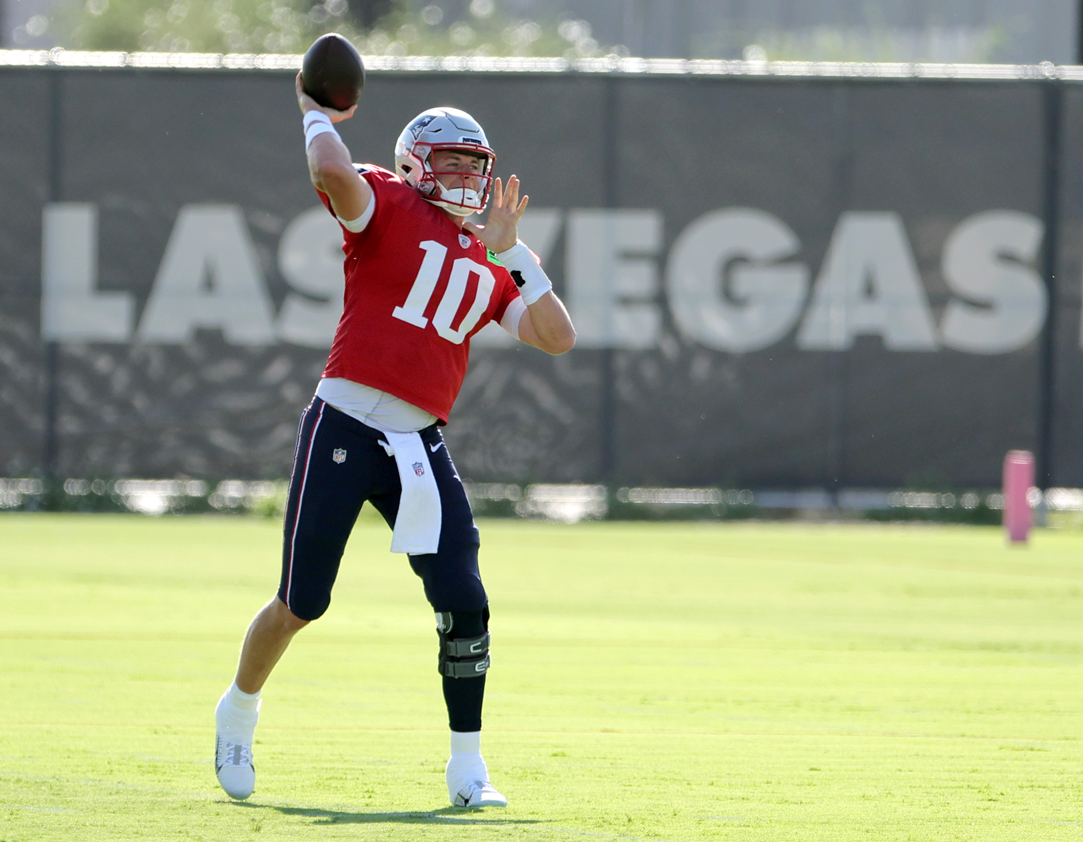 Quarterback Mac Jones of the New England Patriots throws during a joint practice with the Las Vegas Raiders.