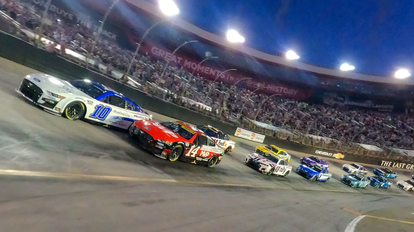 Aric Almirola and Chase Briscoe lead the field on a pace lap prior to the NASCAR Cup Series Bass Pro Shops Night Race at Bristol Motor Speedway on Sept. 17, 2022.