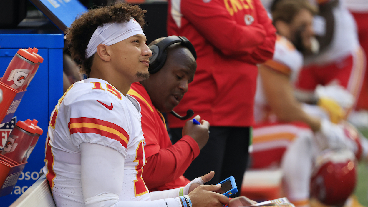 Patrick Mahomes of the Kansas City Chiefs sits on the bench with OC Eric Bieneimy.