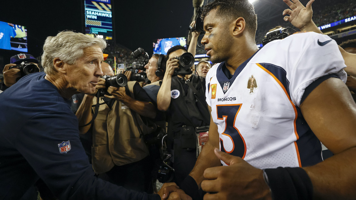 Head coach Pete Carroll of the Seattle Seahawks and Russell Wilson of the Denver Broncos.