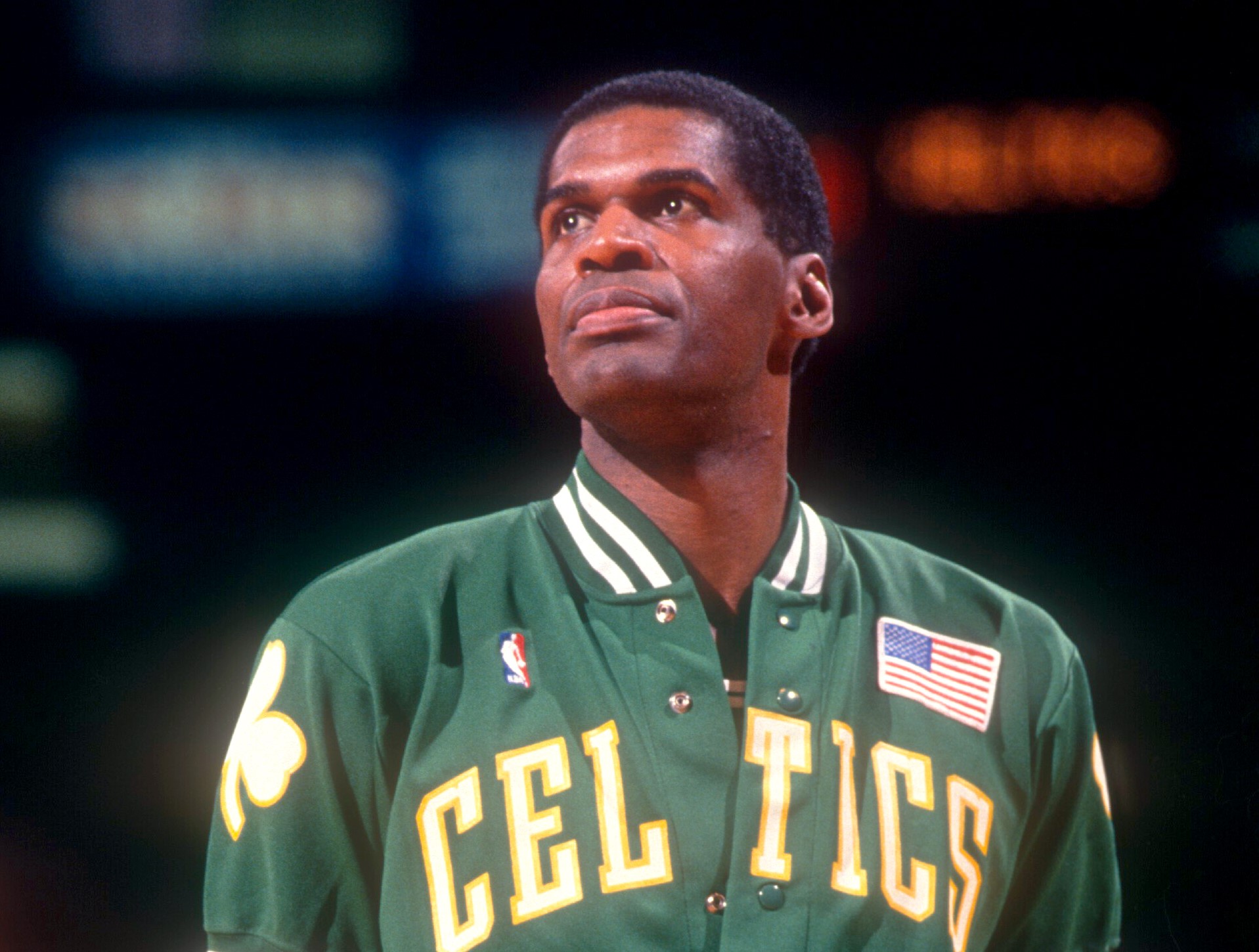 Robert Parish of the Boston Celtics walks on the court during warm-ups prior to an NBA game against the Philadelphia 76ers.