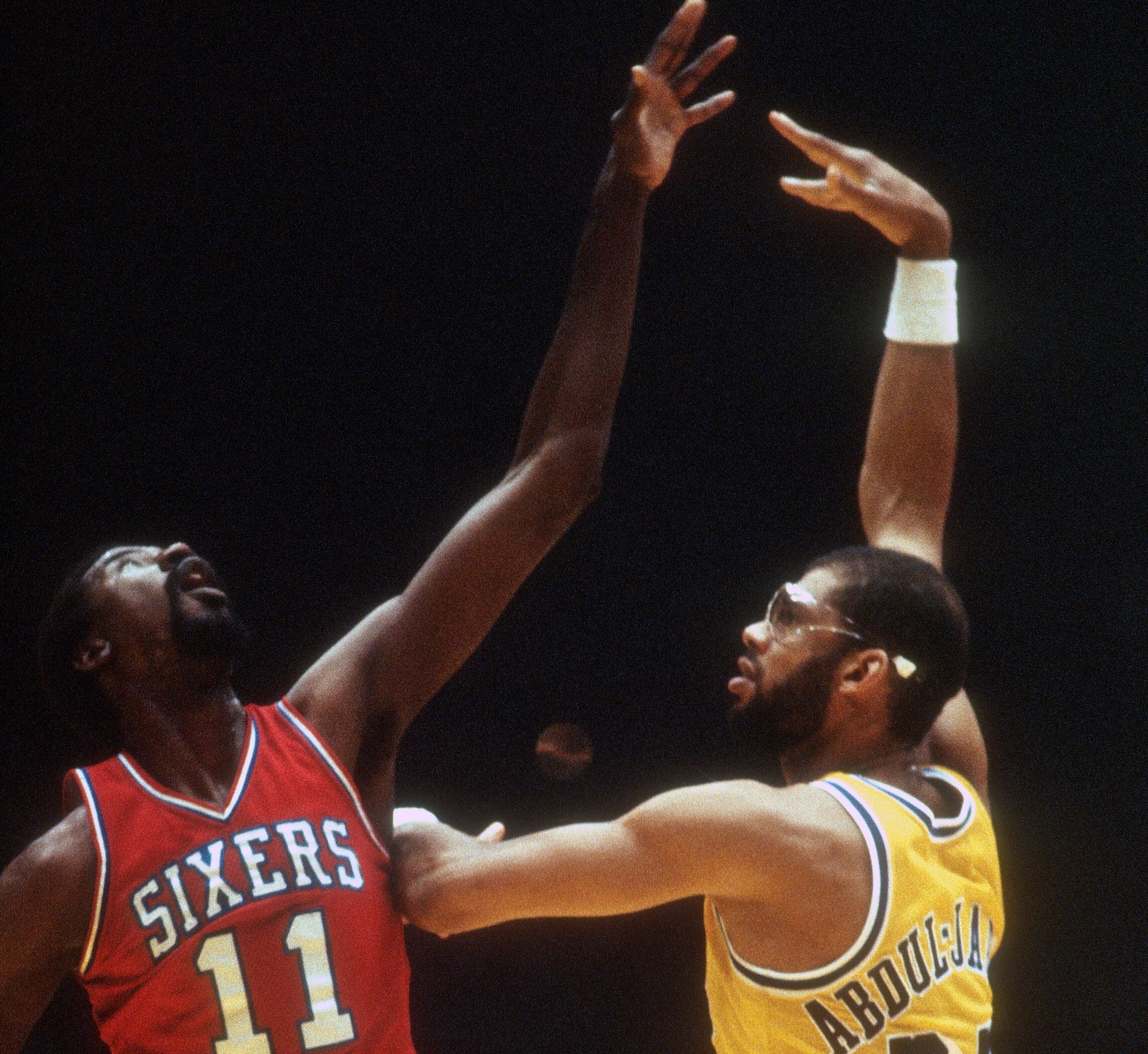 Kareem Abdul-Jabbar of the Los Angeles Lakers shoots over Caldwell Jones of the Philadelphia 76ers.