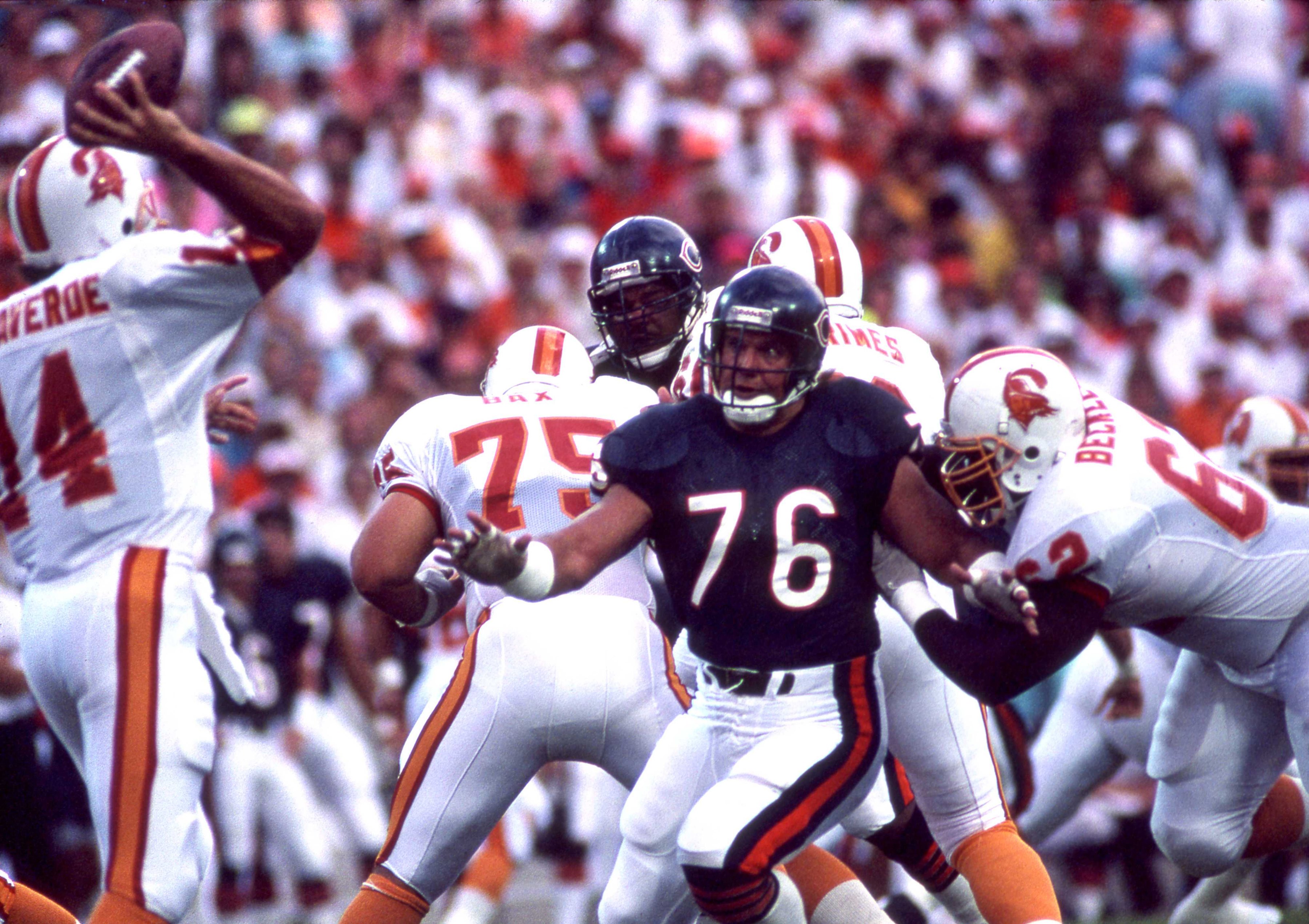 Defensive end Steve McMichael of the Chicago Bears gets past guard Ian Beckles of the Tampa Bay Buccaneers and tries to sack quarterback Vinny Testaverde.