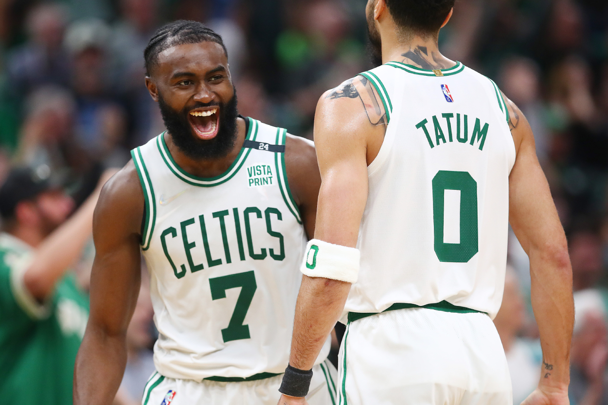 Jaylen Brown reacts with Jayson Tatum of the Boston Celtics during the fourth quarter in Game 7 of the 2022 Eastern Conference Semifinals against the Milwaukee Bucks.