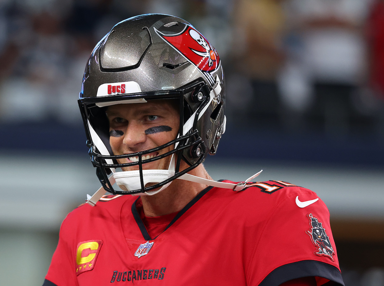 Tom Brady smiles before a game against the Cowboys.