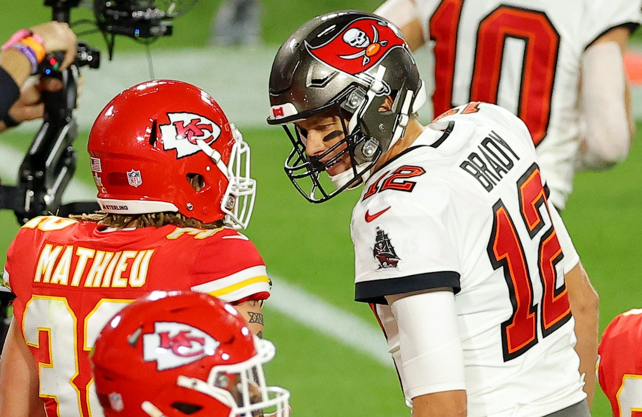 Tom Brady speaks to Tyrann Mathieu during Super Bowl 55.