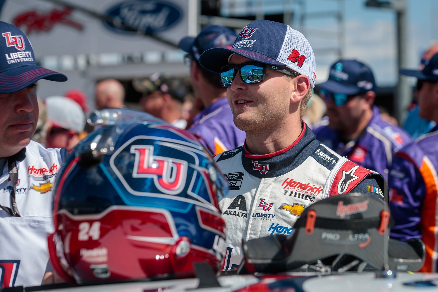 William Byron speaks with his crew on pit road prior to the NASCAR Cup Series Hollywood Casino 400 at Kansas Speedway.