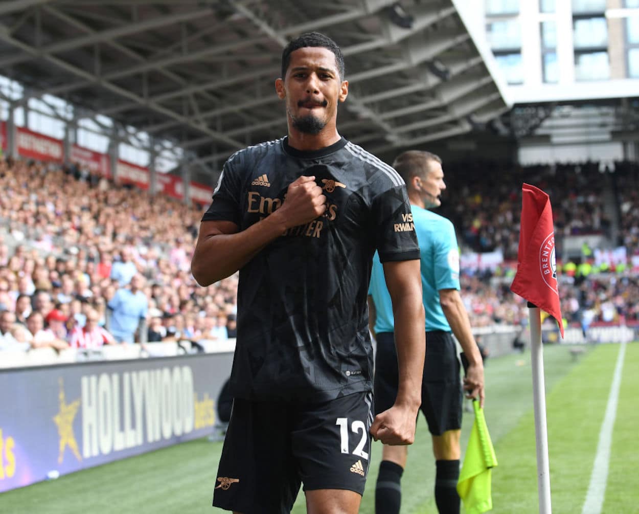 Arsenal defender William Saliba celebrates scoring a goal.