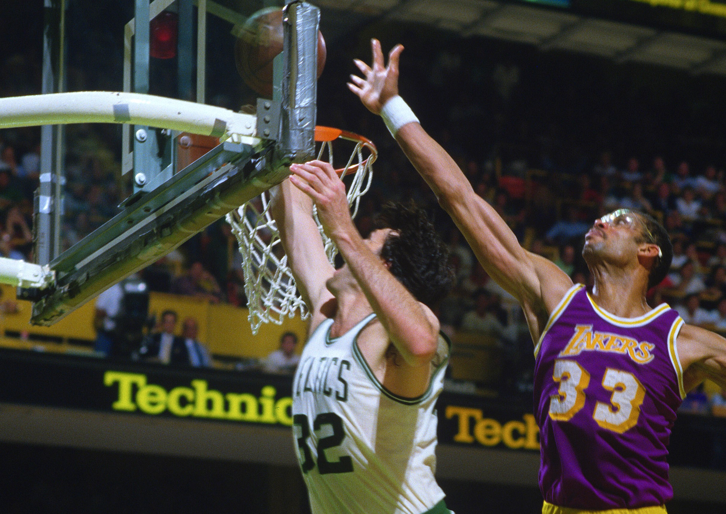 Kevin McHale of the Boston Celtics lays the ball up in front of Kareem Abdul-Jabbar of the Los Angeles Lakers.