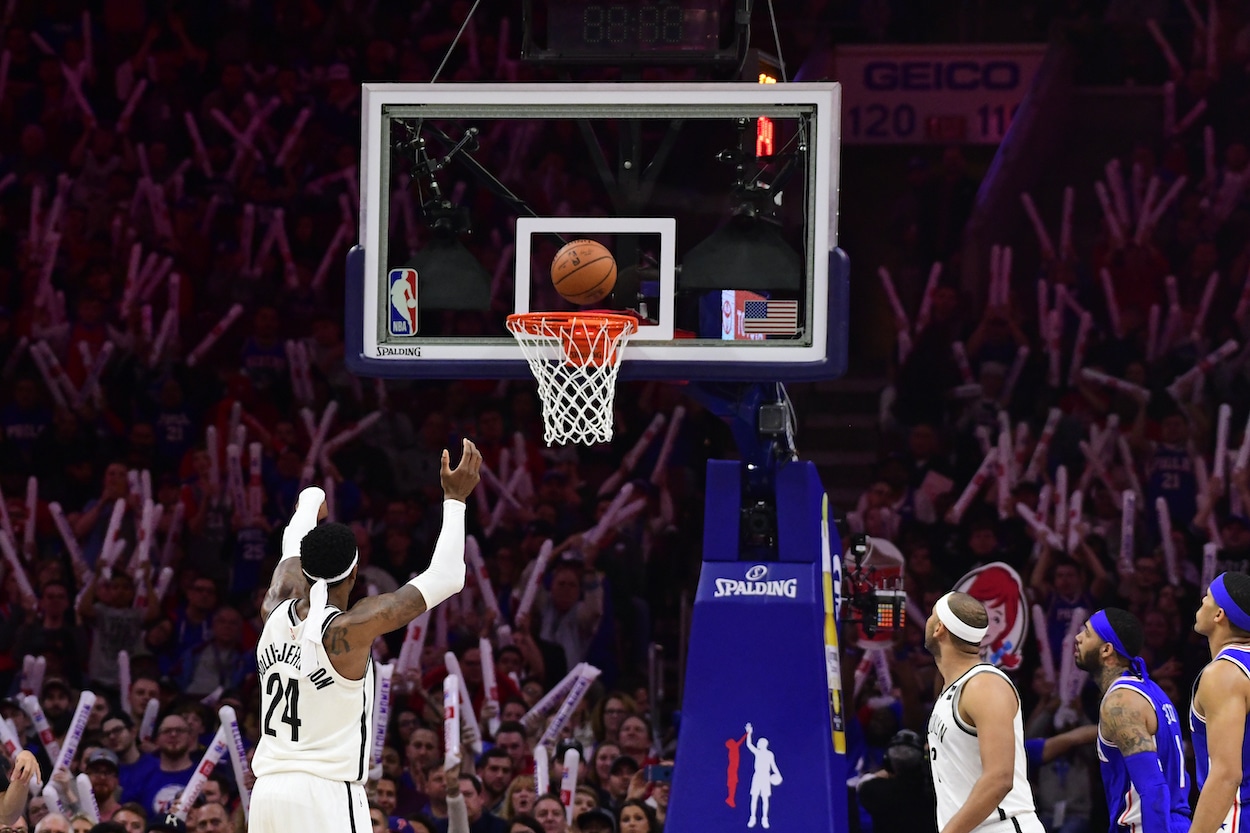 76ers fans cheer during a free throw.