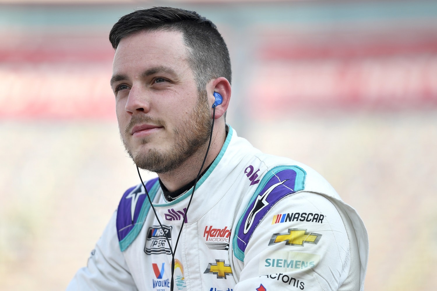 Alex Bowman walks the grid during practice for the NASCAR Cup Series Bass Pro Shops Night Race at Bristol Motor Speedway on Sept. 16, 2022.