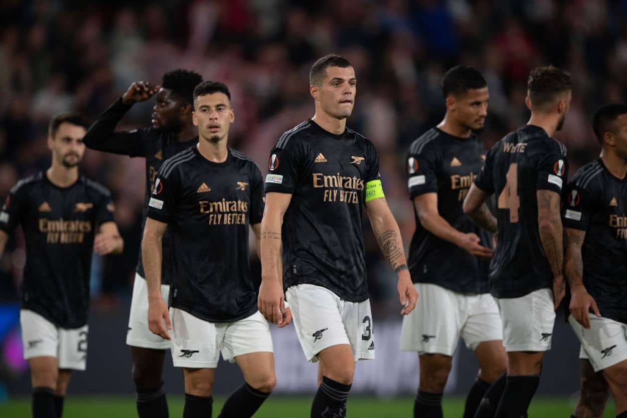 Granit Xhaka leads Arsenal off the pitch after a defeat against PSV.