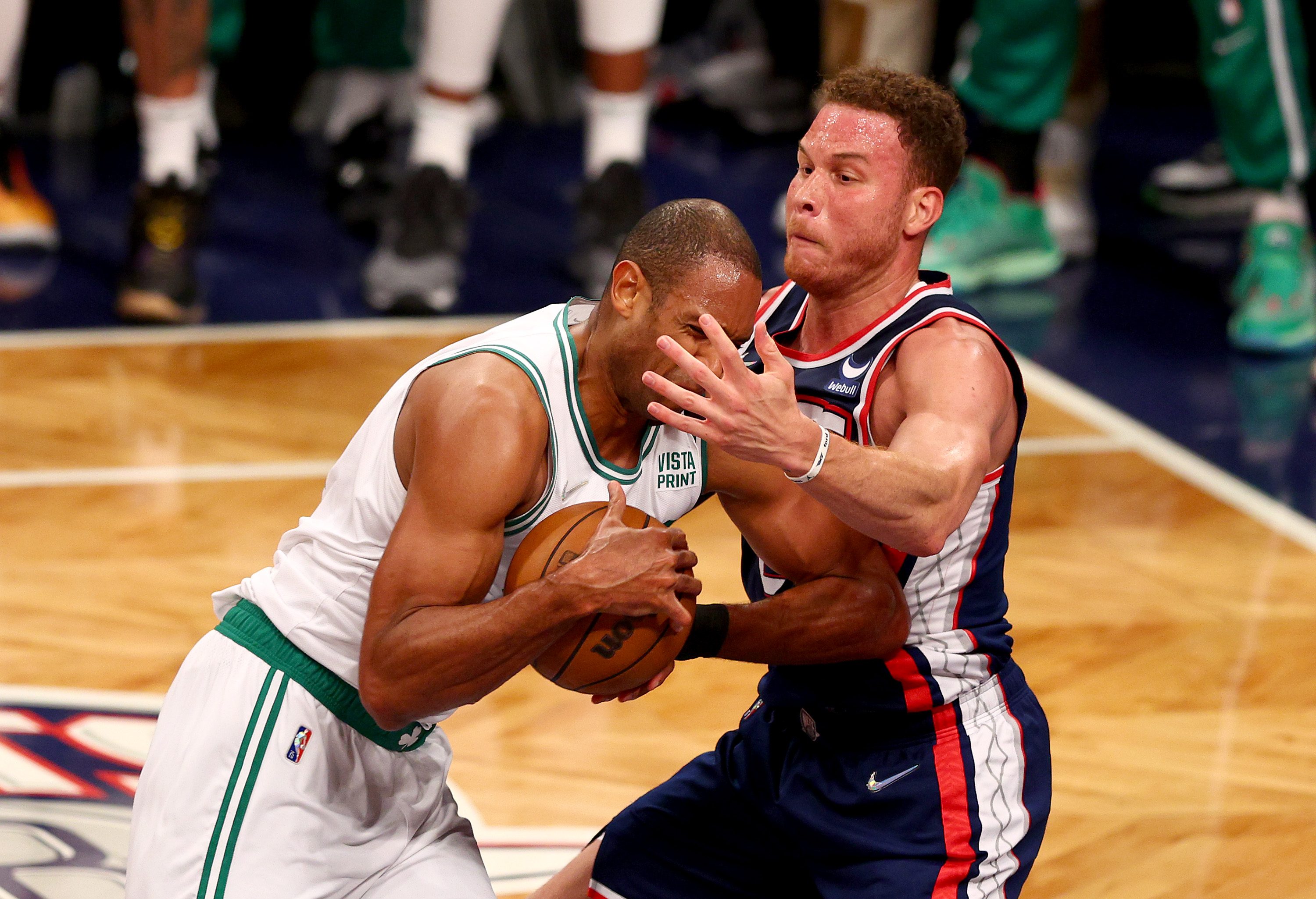 Al Horford of the Boston Celtics tries to get past Blake Griffin of the Brooklyn Nets.