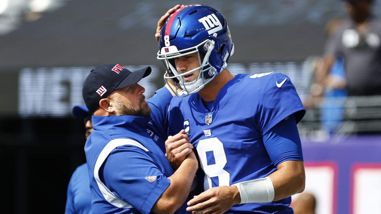 Head coach Brian Daboll of the New York Giants talks with quarterback Daniel Jones.