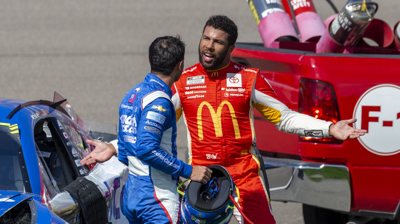 Bubba Wallace confronts Kyle Larson after they wrecked during the NASCAR Cup Series South Point 400 on Oct. 16, 2022.