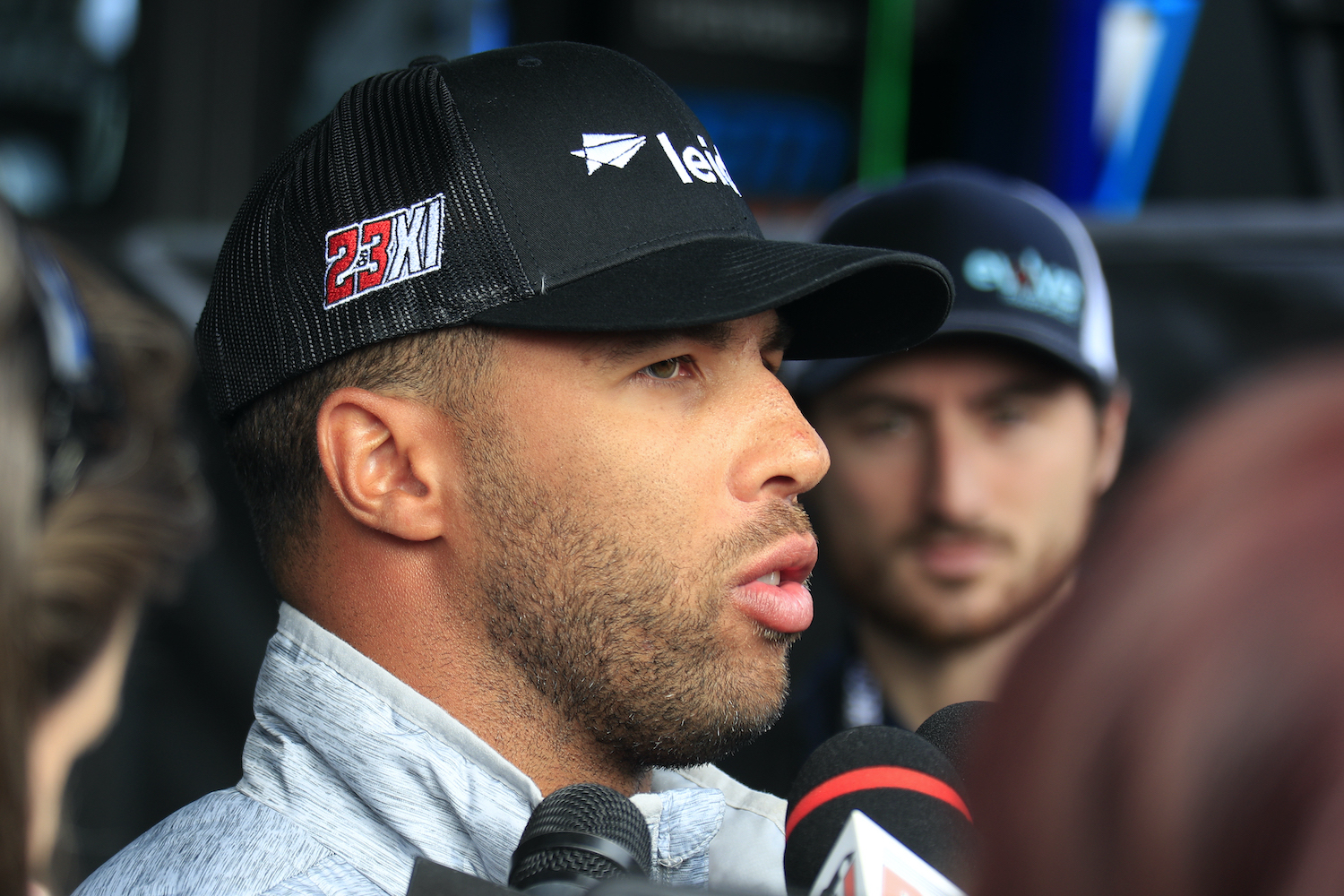 Bubba Wallace talks to reporters
