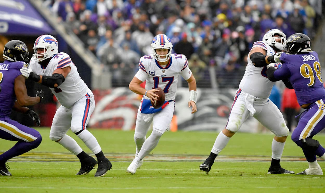 Buffalo Bills quarterback Josh Allen runs with the ball.