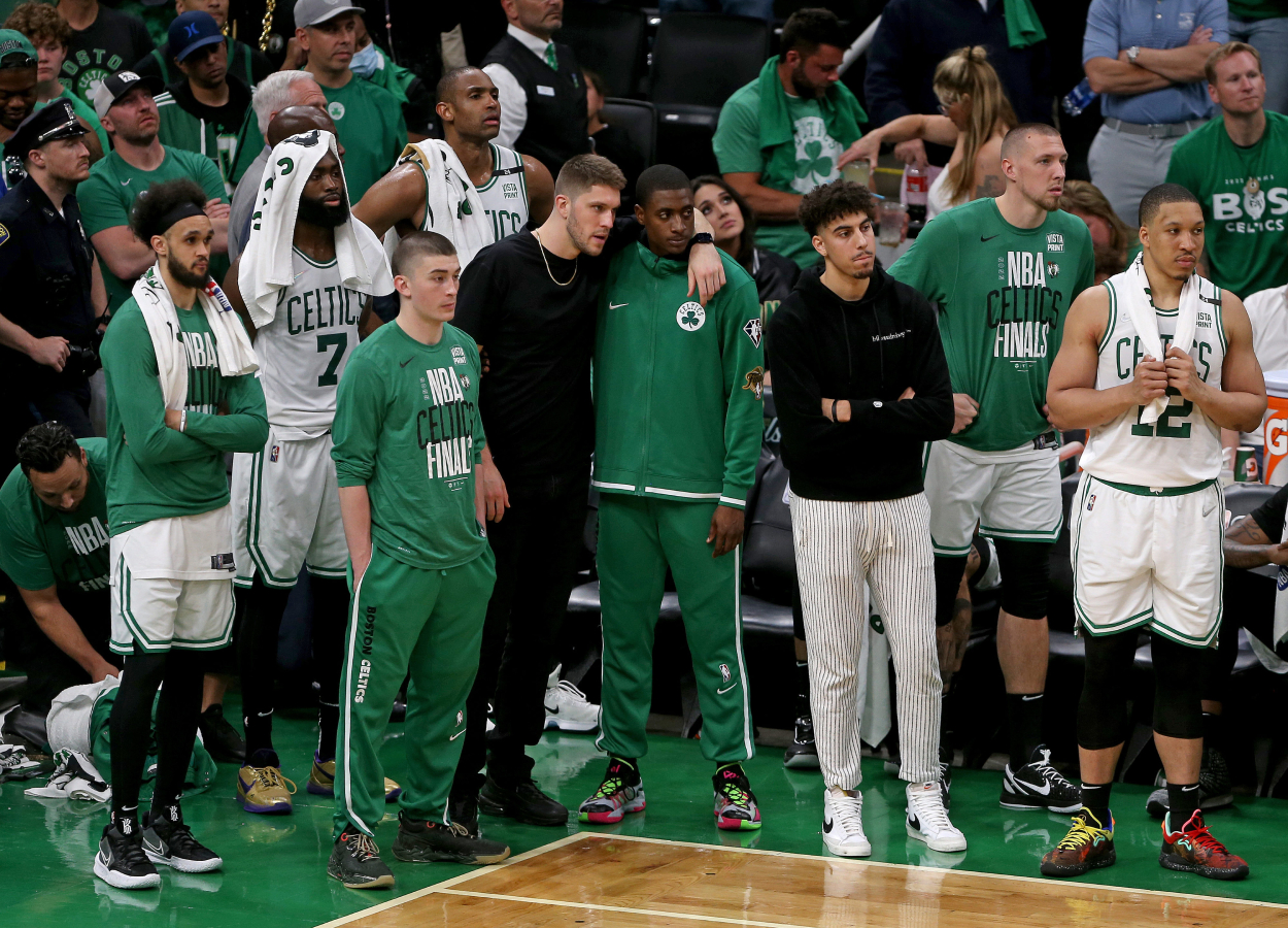 A dejected Celtics bench looks on as the Golden State Warriors win 103-90 during the Game 6 of the NBA Finals.