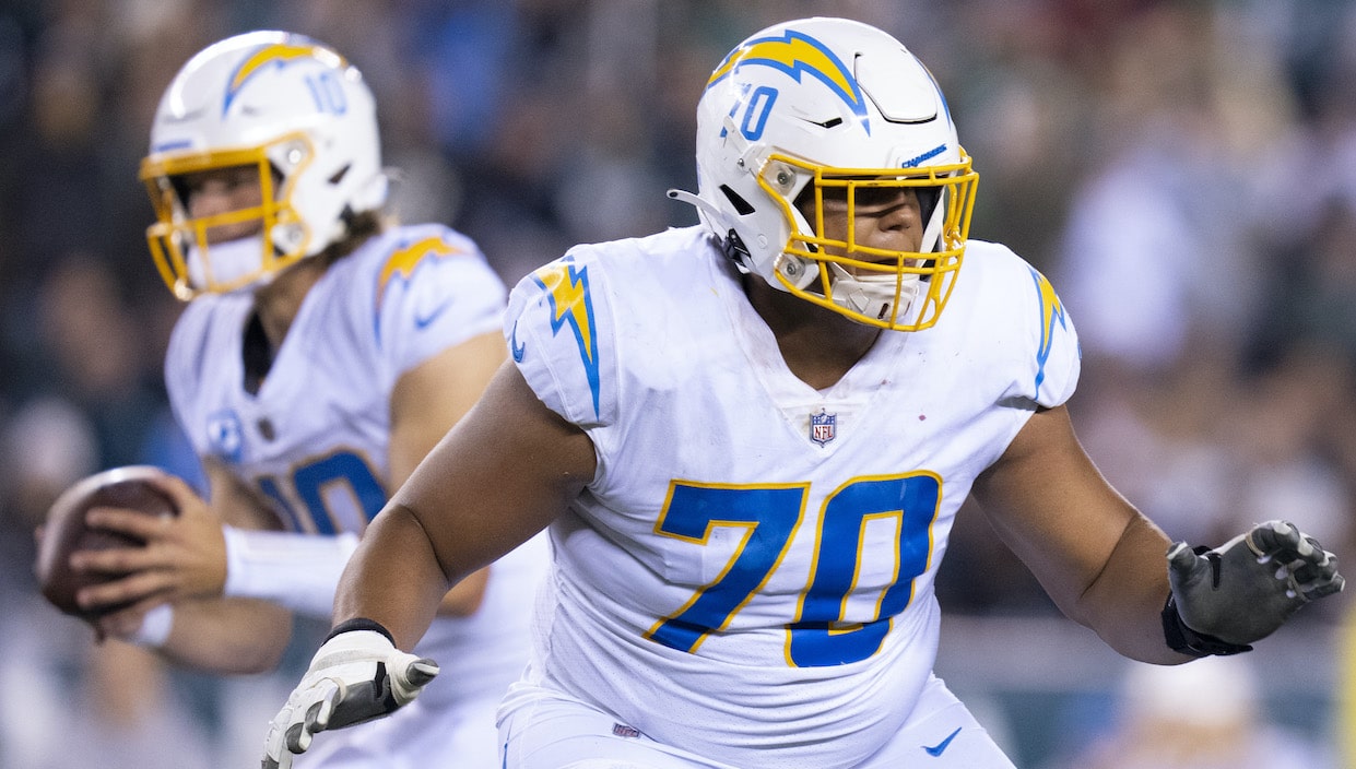 Rashawn Slater of the Los Angeles Chargers blocks for Justin Herbert.