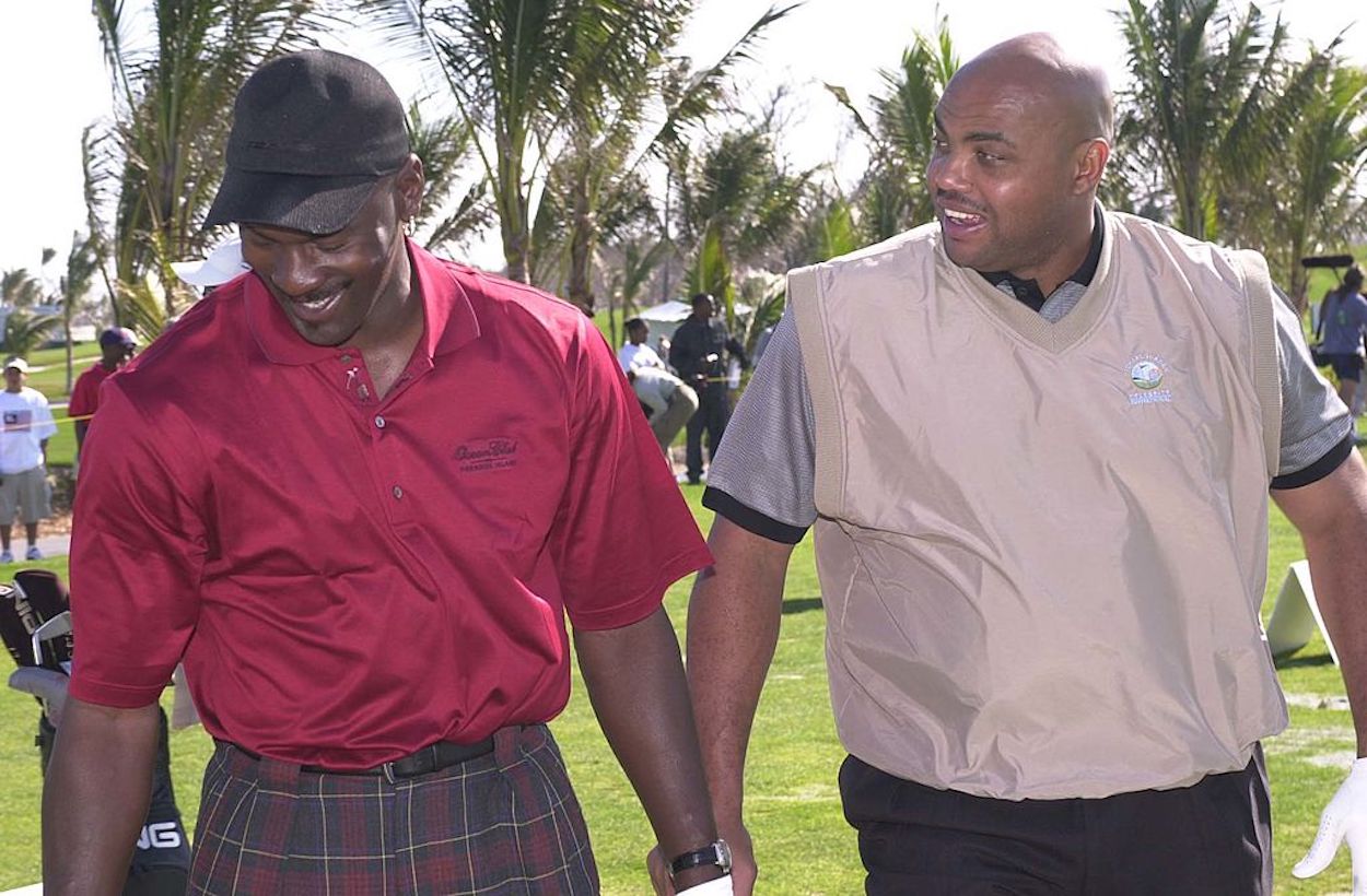 Michael Jordan (L) and Charles Barkley (R) laugh during a round of golf.