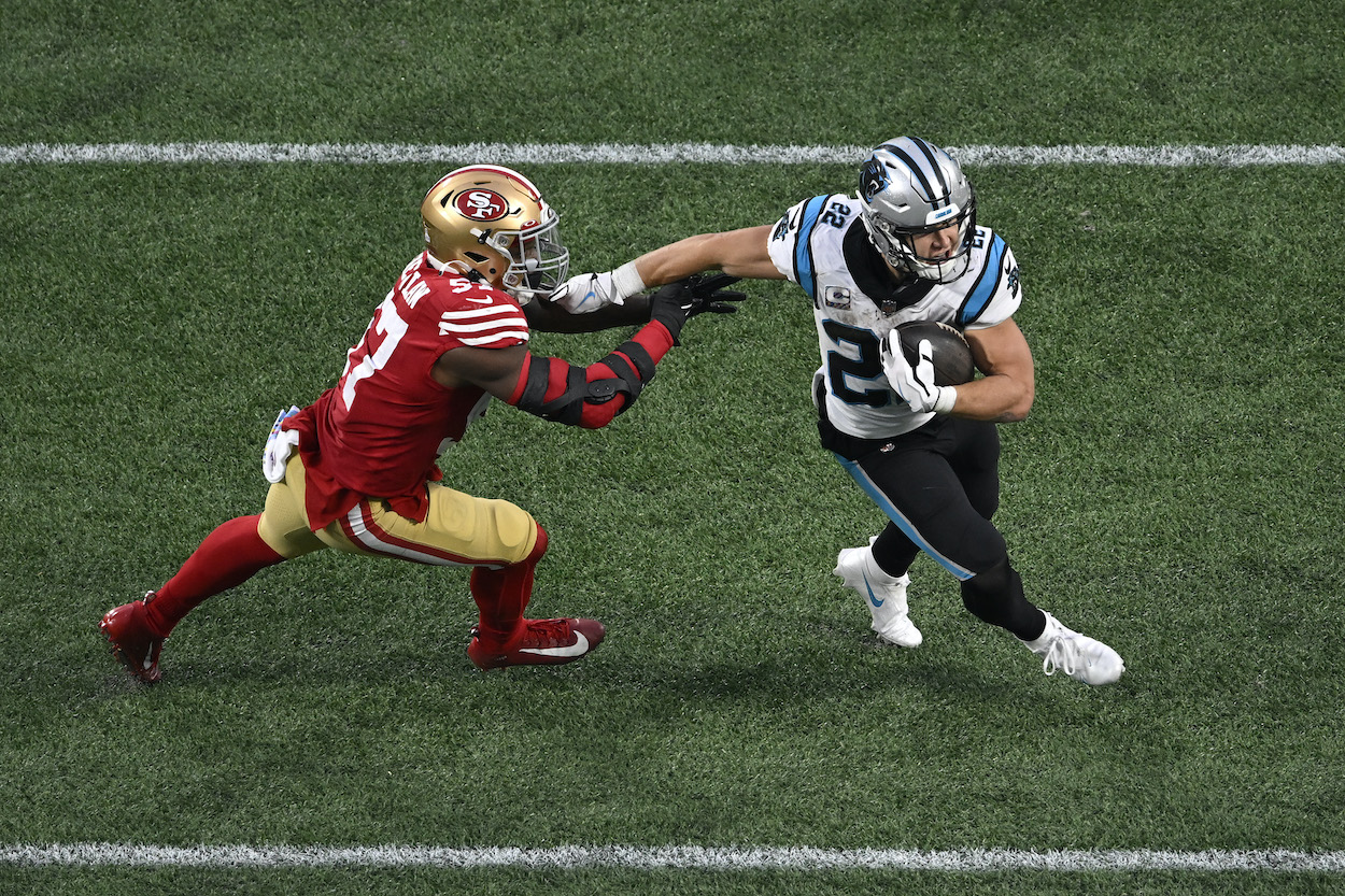Christian McCaffrey avoids a tackle against the 49ers.