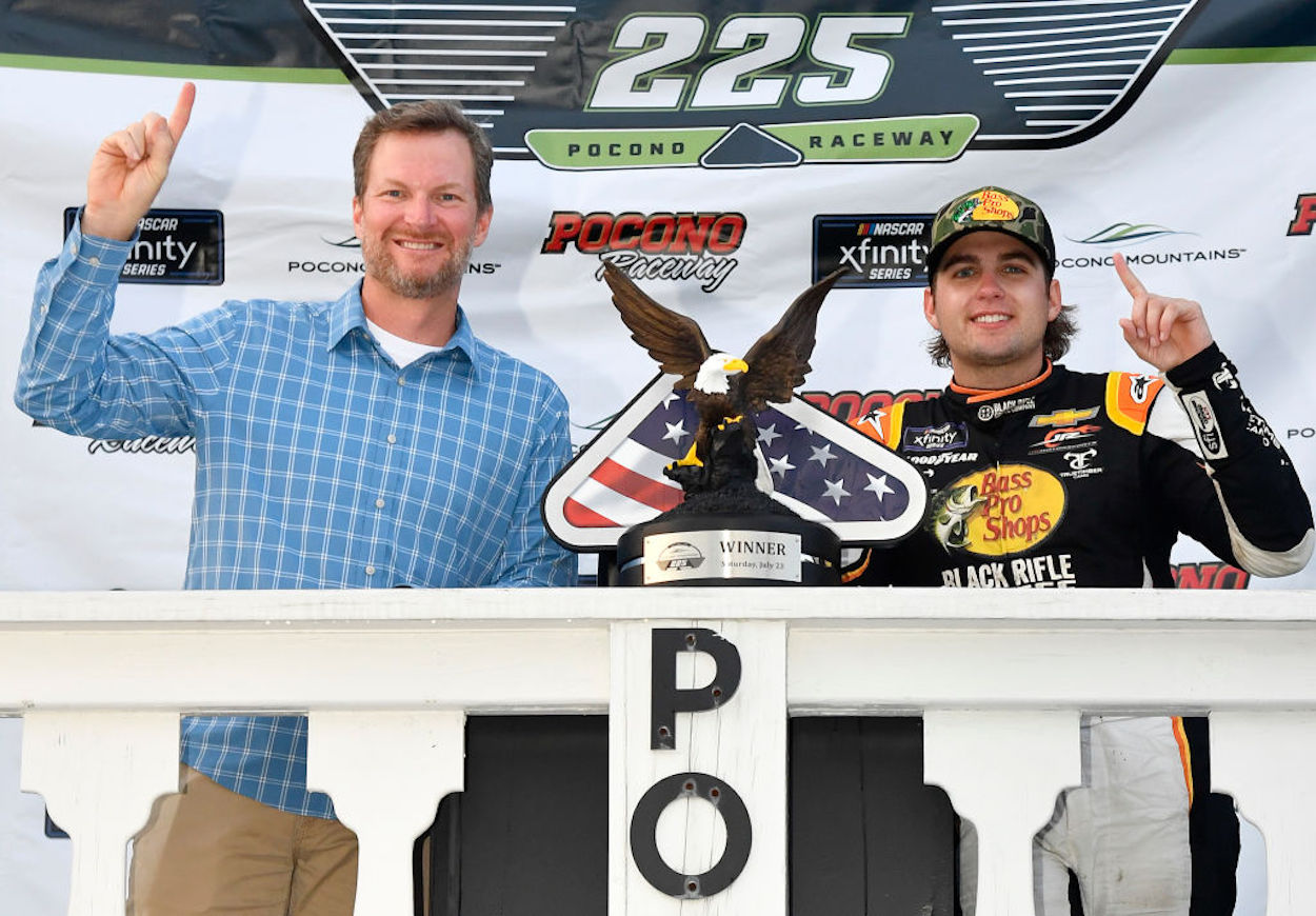 Noah Gragson (R) and Dale Earnhardt Jr. (L) pose after winning the NASCAR Xfinity Series Explore the Pocono Mountains 225.