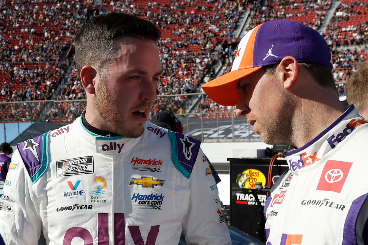Alex Bowman and Denny Hamlin, talk on the grid ahead of the NASCAR Cup Series Busch Light Clash.