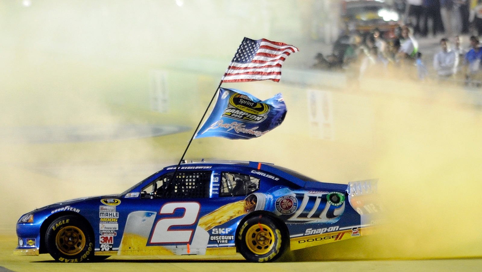 Brad Keselowski of Team Penske celebrates with a burnout after winning the NASCAR Cup Series championship at Homestead-Miami Speedway on Nov. 18, 2012, in the final race for Dodge.