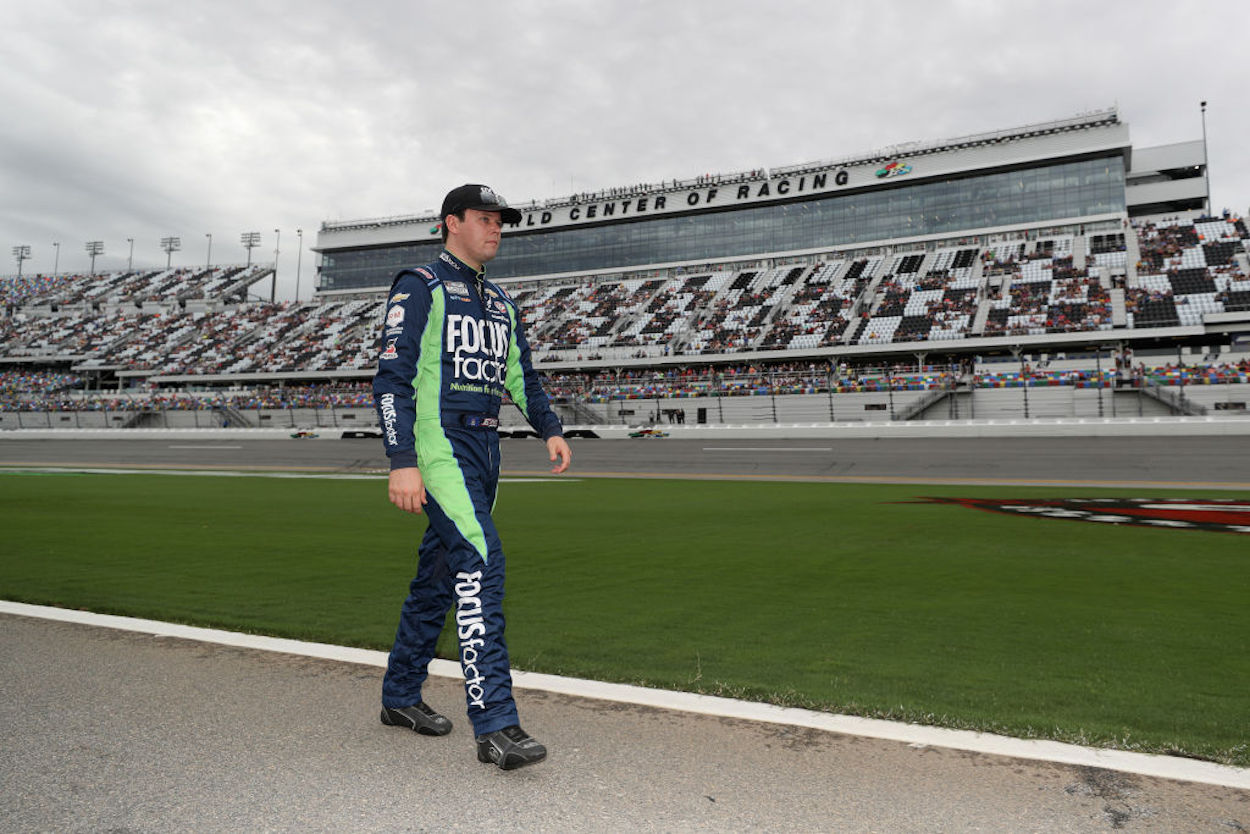 Erik Jones walks the grid prior to the NASCAR Cup Series Coke Zero Sugar 400.