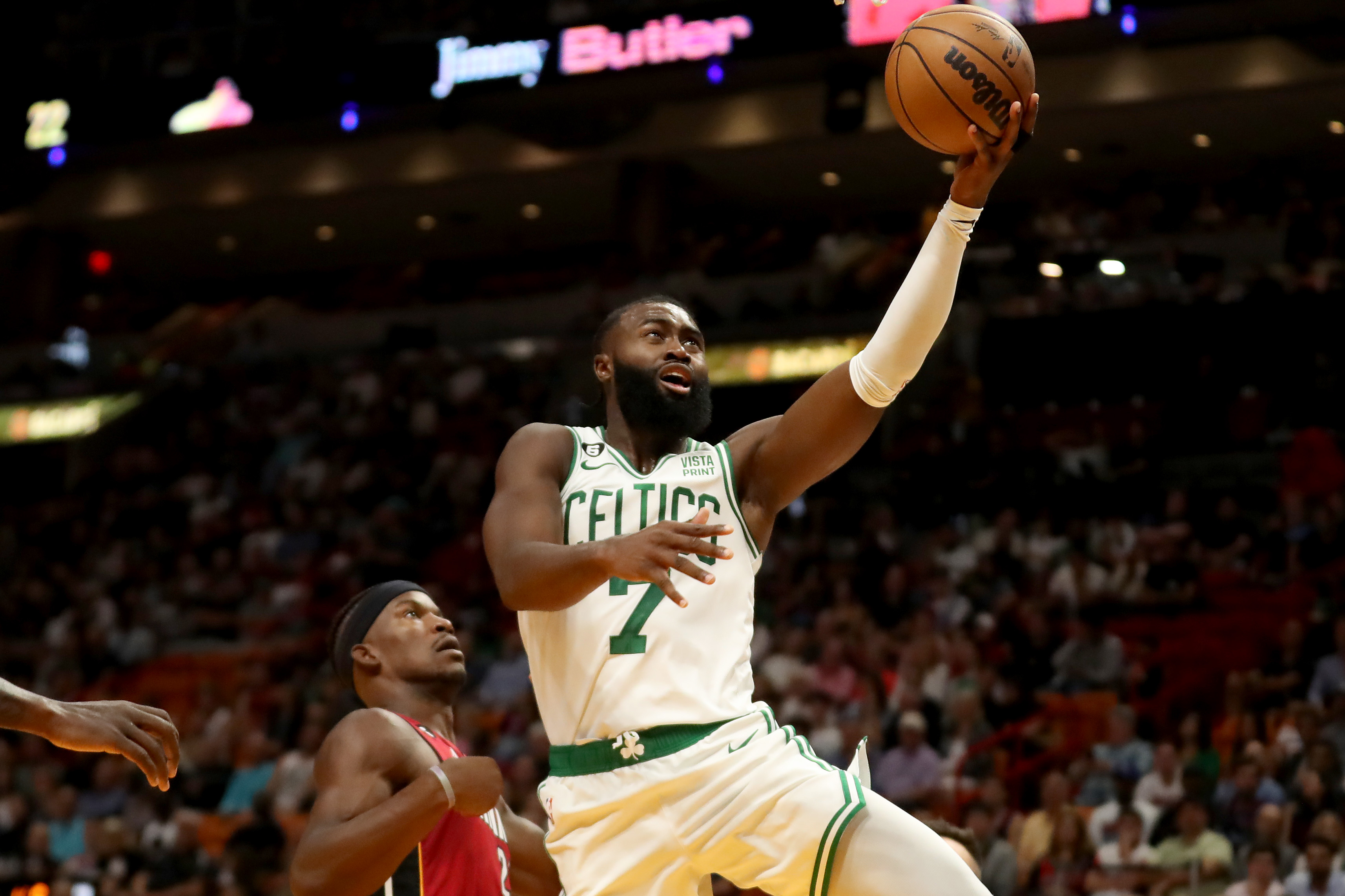 Jaylen Brown of the Boston Celtics shoots past Jimmy Butler of the Miami Heat.