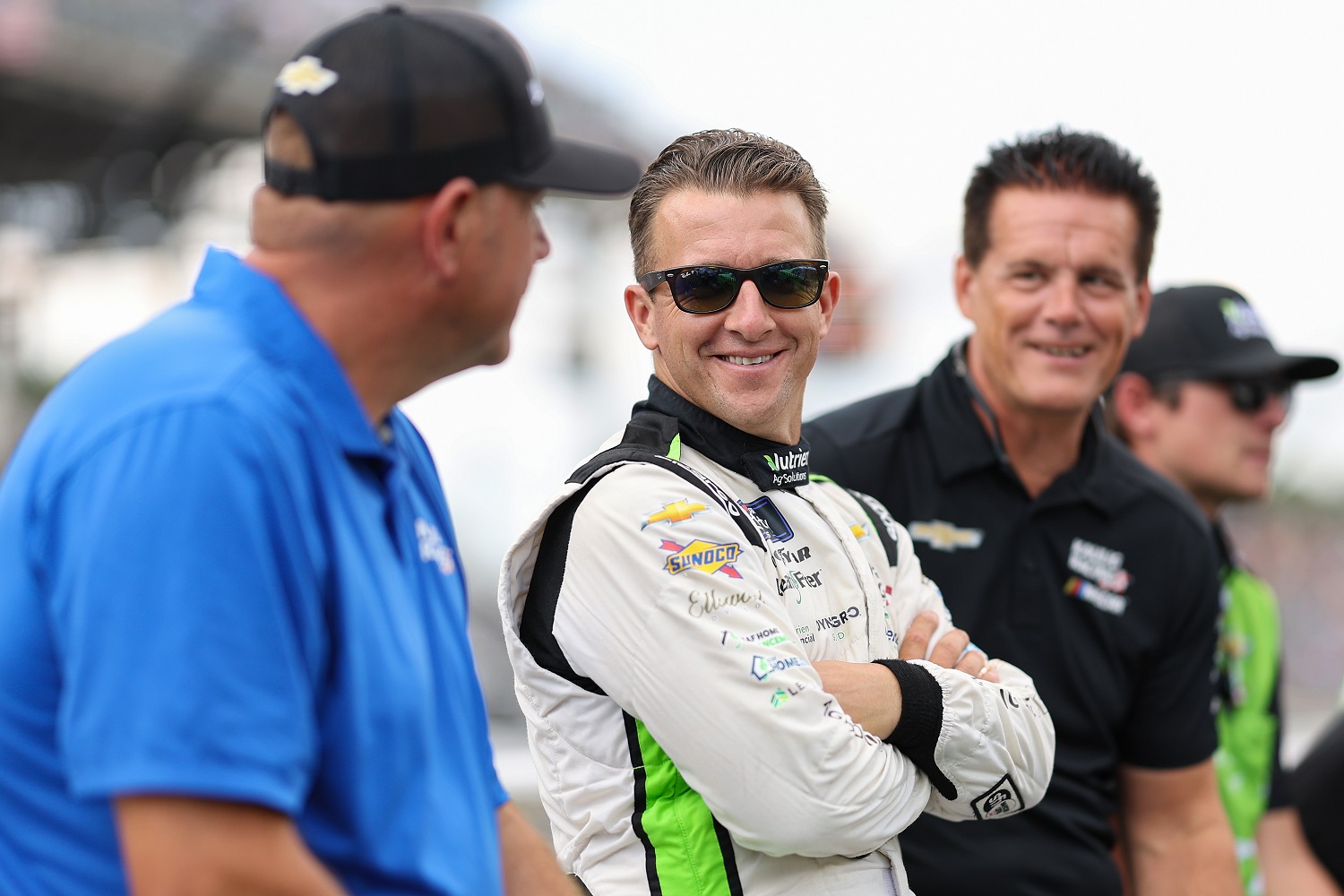 Team president Chris Rice, driver AJ Allmendinger, and owner Matt Kaulig of Kaulig Racing talk on the grid prior to the the NASCAR Xfinity Series Pennzoil 150 at the Brickyard at Indianapolis Motor Speedway on July 30, 2022.