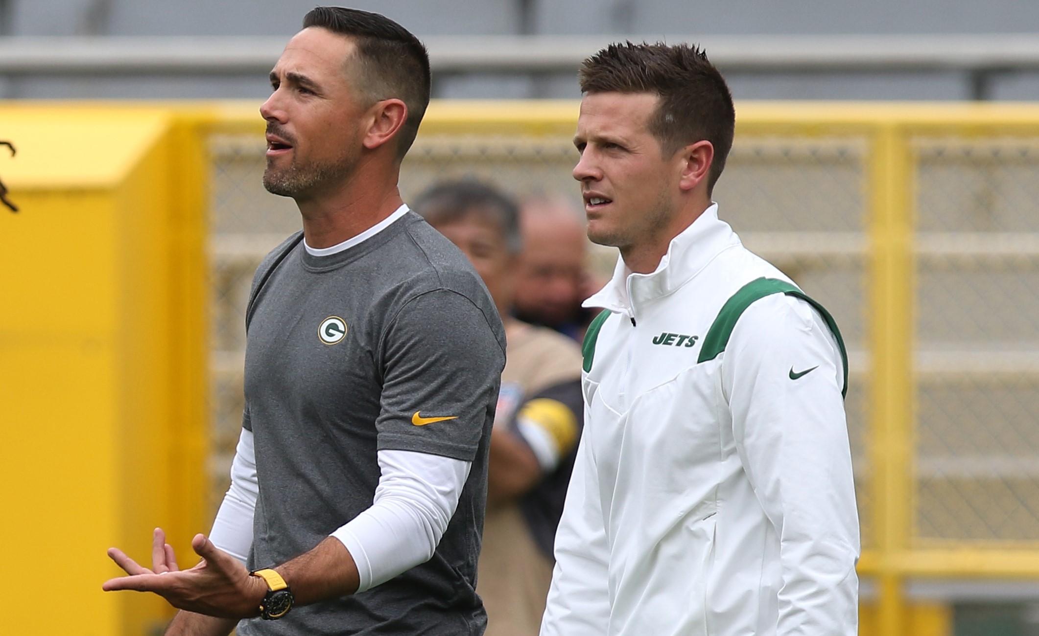 Green Bay Packers head coach Matt LaFleur walks out with his brother New York Jets offensive coordinator Mike LaFleur.