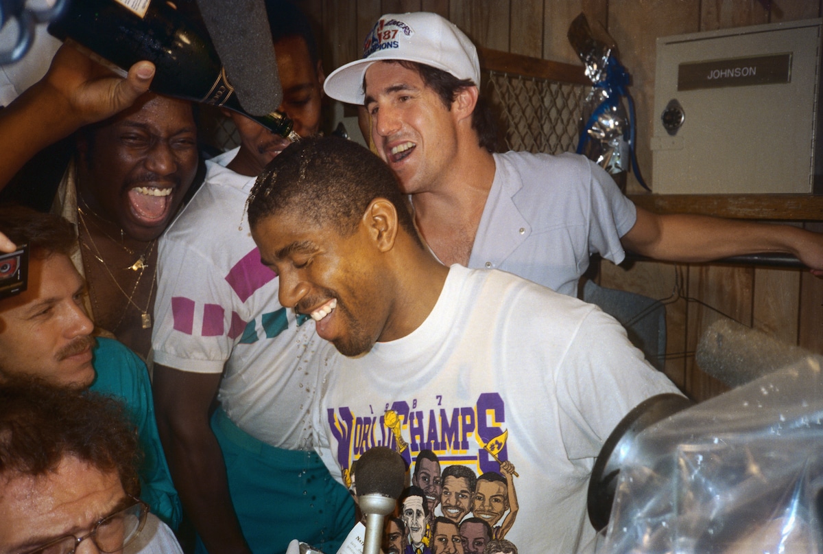 Lakers guard Magic Johnson gets doused with champagne after the Lakers defeated the Celtics to win the NBA Championship